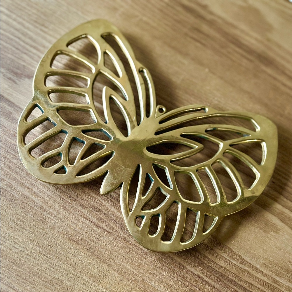 Vintage brass butterfly trivet - has a hole to be hung